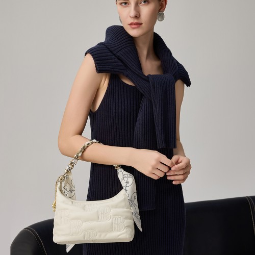 One-shoulder crossbody bag with super soft embossed leather under arm.