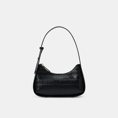A pink silver bag with a design on one shoulder A pink silver bag with a design on one shoulder