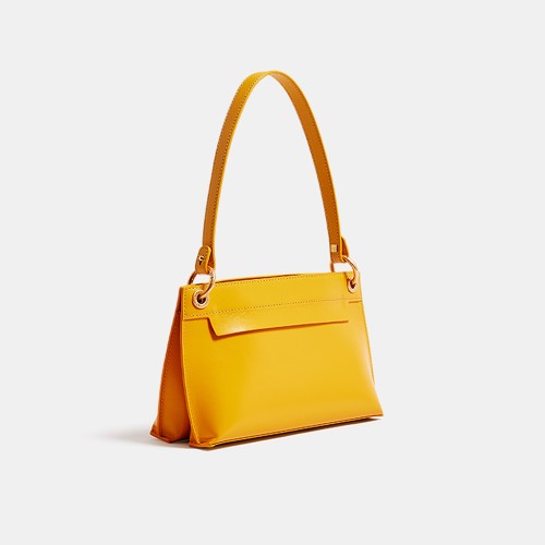 The underarm bag straddles the foreskin of Noy Atlier