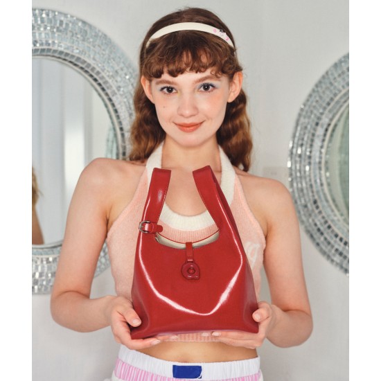Leather can be worn cross-body in a portable bento bag Leather can be worn cross-body in a portable bento bag