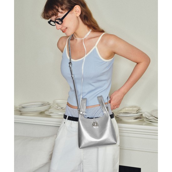 Leather can be worn cross-body in a portable bento bag Leather can be worn cross-body in a portable bento bag